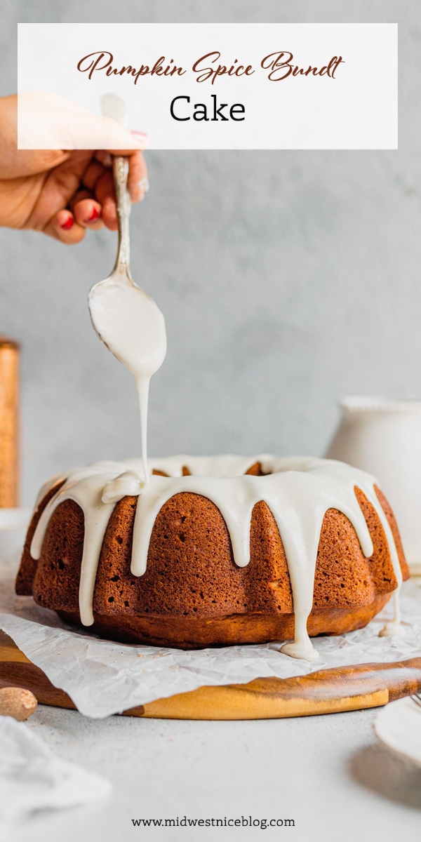 A hand drizzles glaze over a pumpkin spice bundt cake.